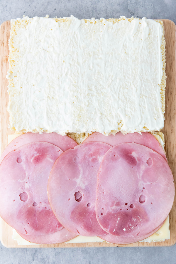 add ham on top of swiss cheese