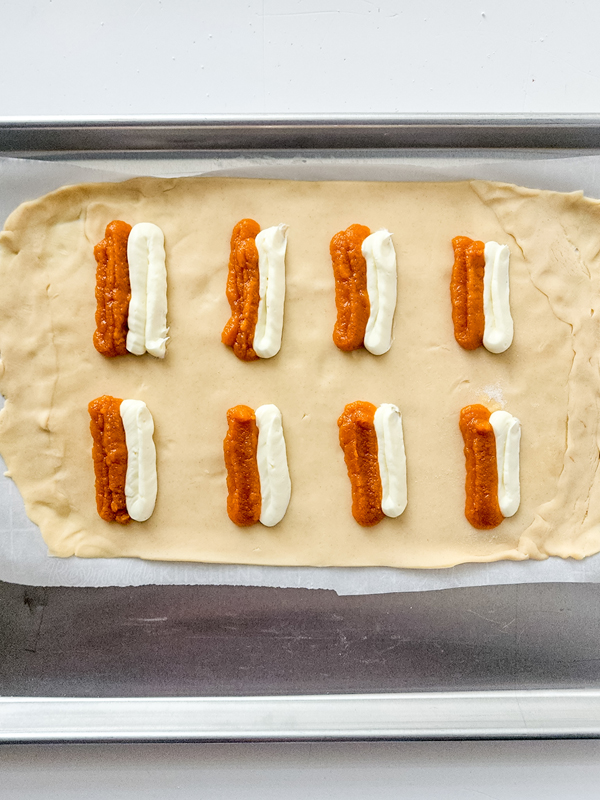 add pumpkin and cream cheese filling on top of the pie crust