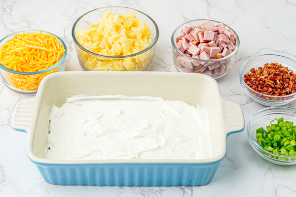 spread the cream cheese mixture in the bottom of a serving dish