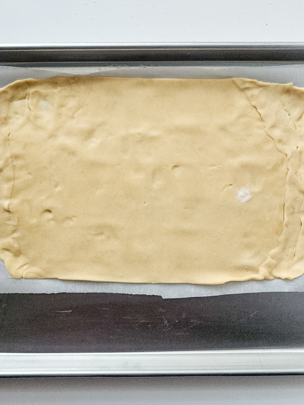 pie crust on parchment lined baking sheet