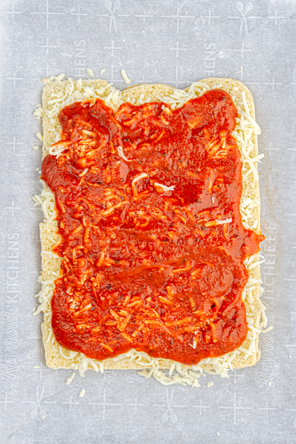 add sauce on top of cheese and spread easily