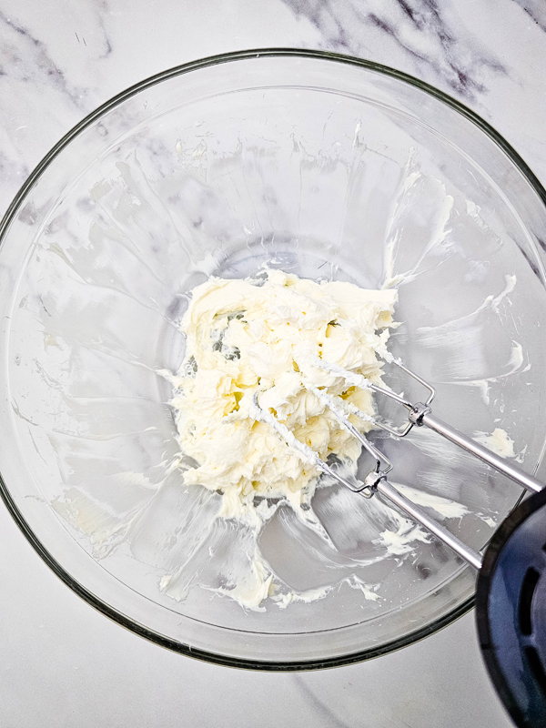 mix cream cheese and powdered sugar in a bowl