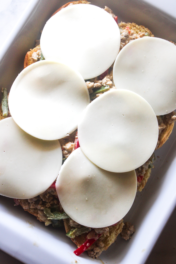 add slices of provolone on top of chicken mixture