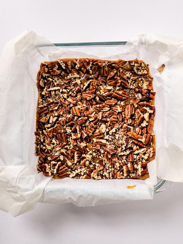 top fudge layer with chopped pecans
