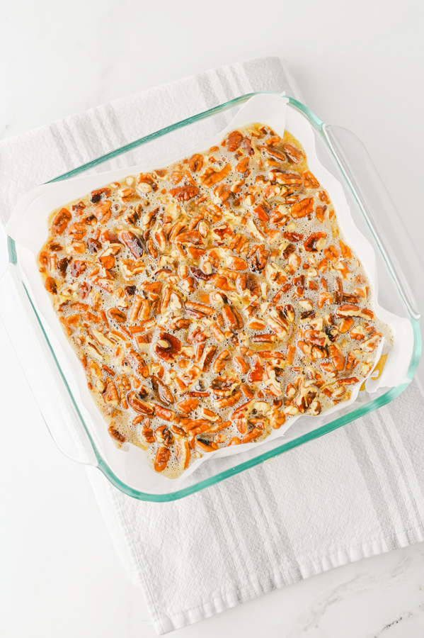 pour pecan pie ingredients over the crust and bake