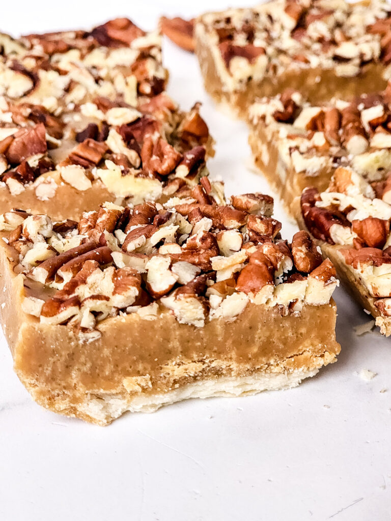closeup of maple pecan pie fudge squares on a counter