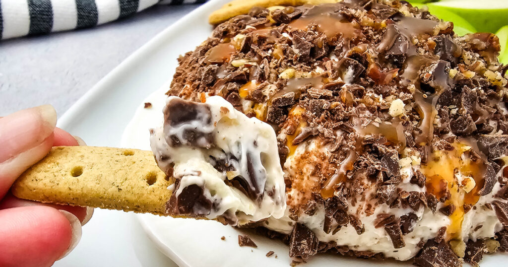 caramel apple cheesecake dip on a cookie
