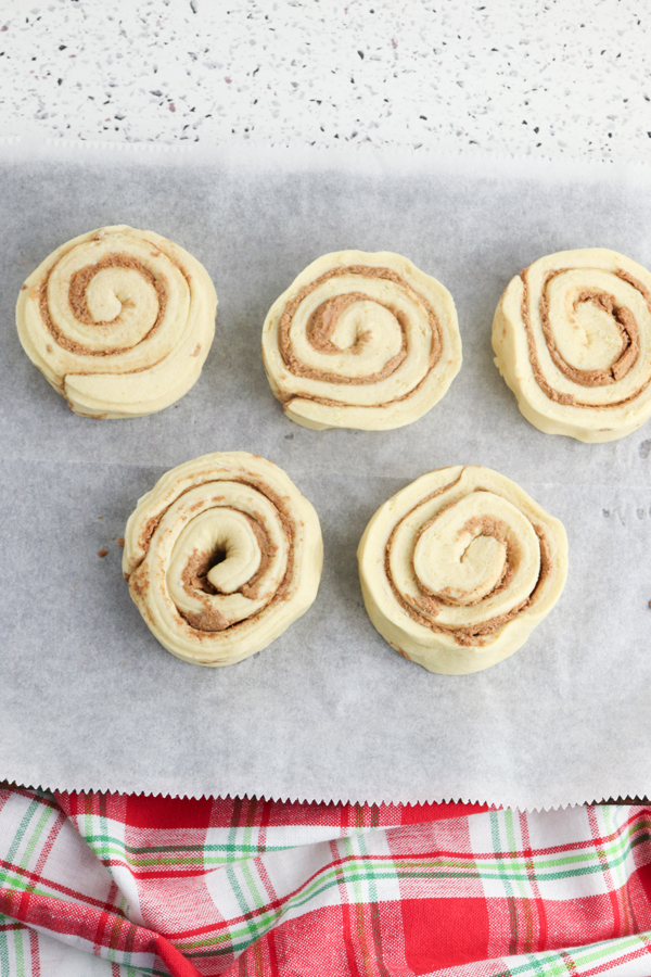 place cinnamon rolls on parchment and bake until done