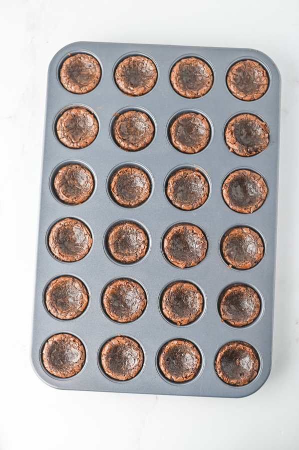after baking the brownies, indent the tops with a spoon