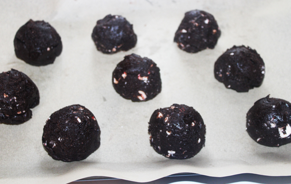 chocolate peppermint cookie dough balls on parchment