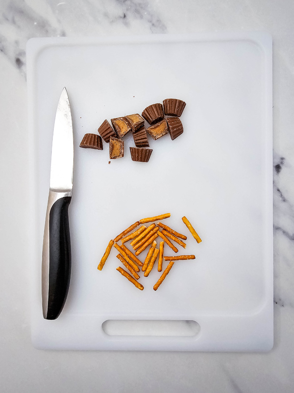 chop reese's in half and break the pretzel sticks