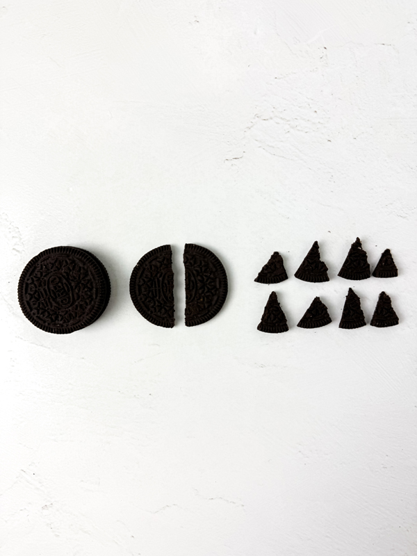 create the bat wings and ears from the chocolate cookies