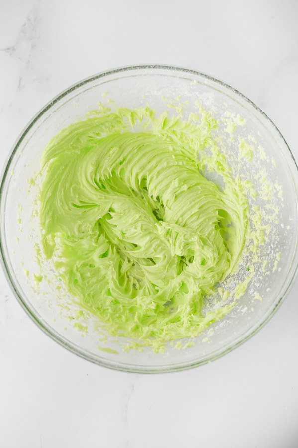 create the frosting and tint it with the neon green food coloring
