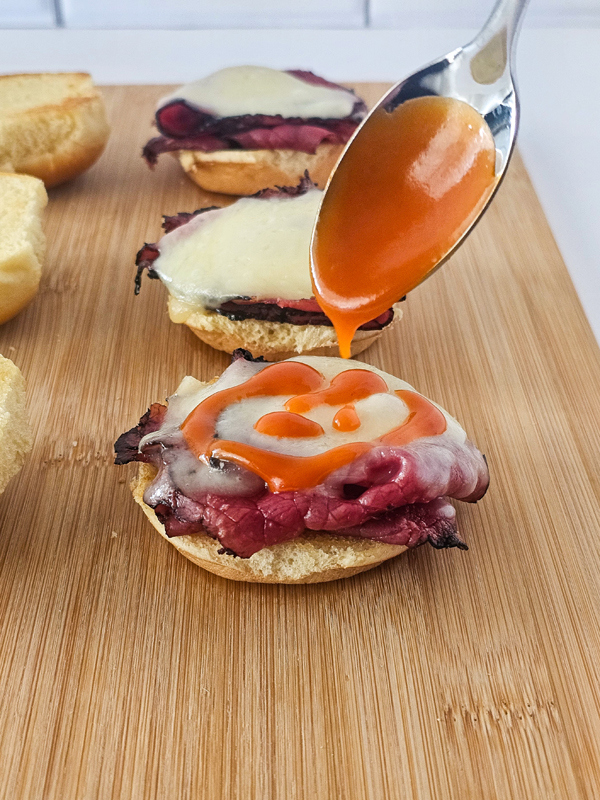 drizzle the dressing over the cheese.