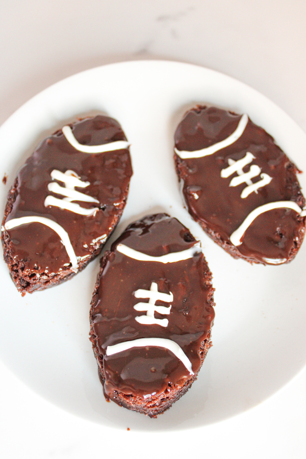 use the white chocolate to create football strings