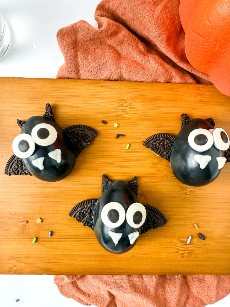 halloween bat truffles on a cutting board