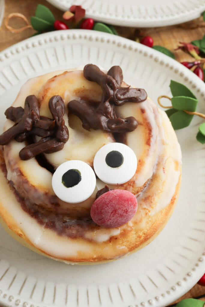cute holiday rudolph cinnamon roll on a plate