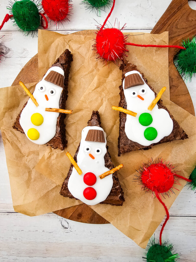 cute snowman brownies on a cutting board