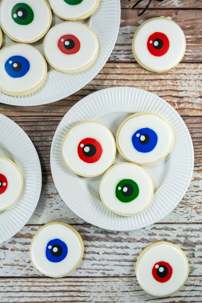 overhead shot of halloween eyeball cookies on plates