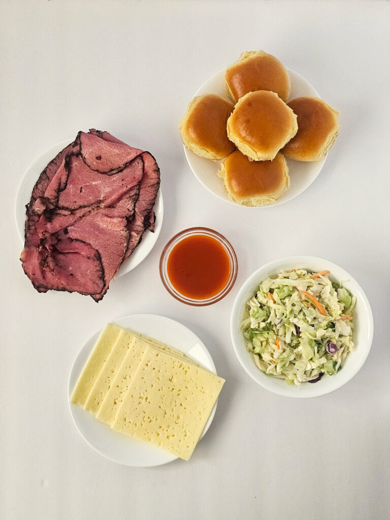 overhead shot of ingredients for pastrami slaw sliders