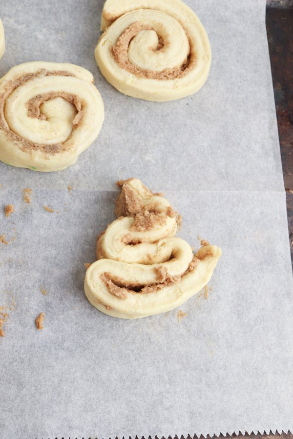 shape cinnamon roll dough into triangles