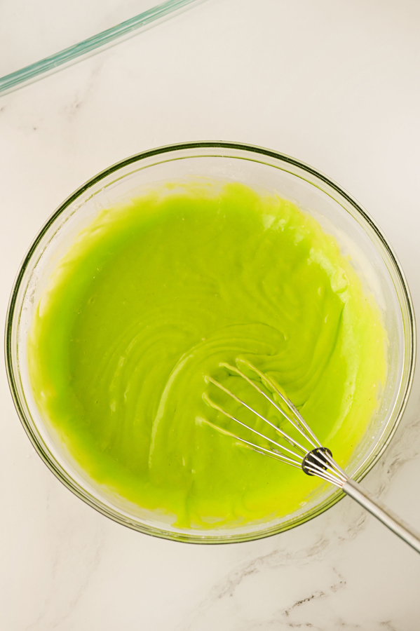 add green food coloring to the cake mix before baking