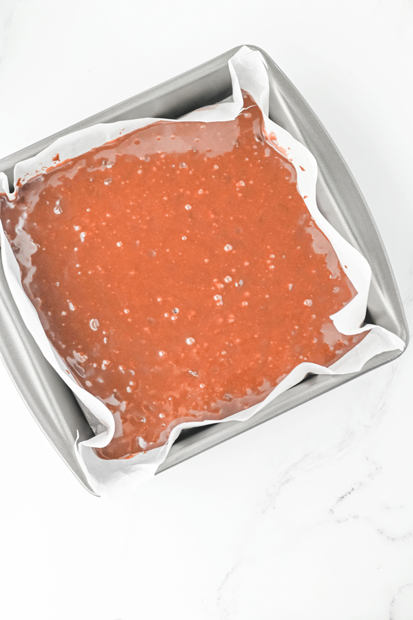 pour into parchment lined pan and bake