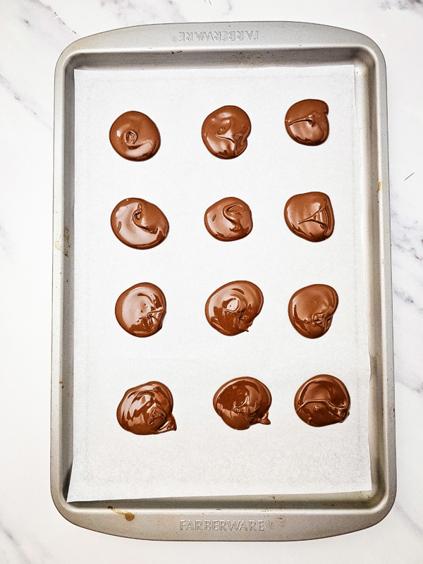 create small circles of chocolate on the parchment