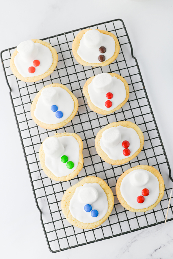 add m&ms to each cookie to make snowman buttons