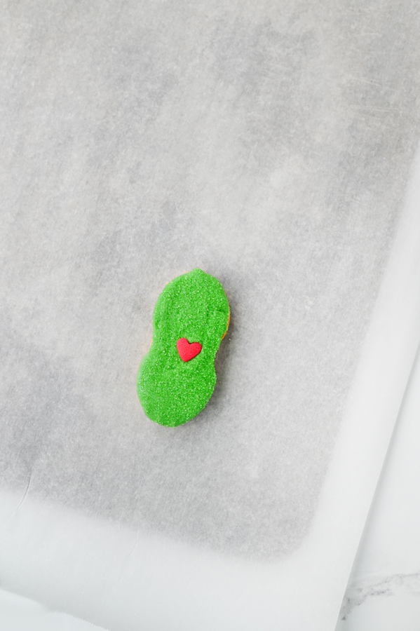 add a heart candy to each cookie