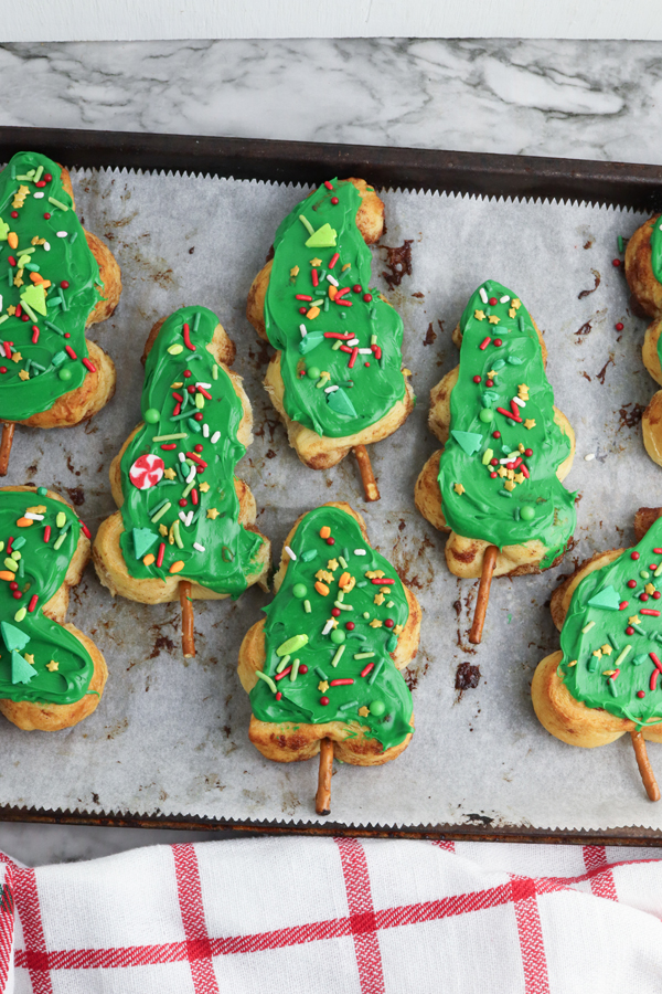 coat each tree with green icing and add sprinkles to decorate