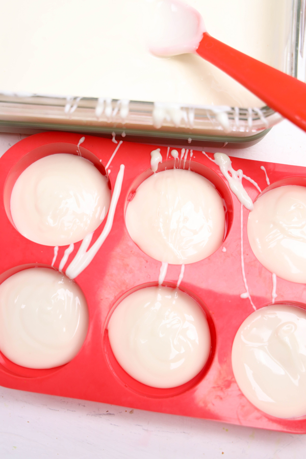 spoon chocolate into bottom of each mold