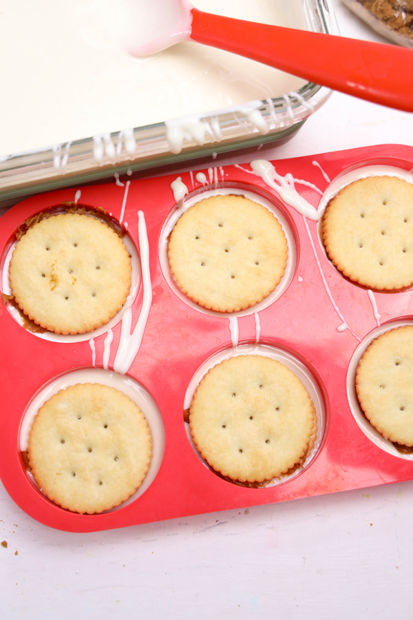 place the crackers on top of the chocolate in the mold