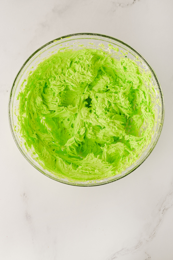 mix together frosting ingredients and tint with neon green food coloring