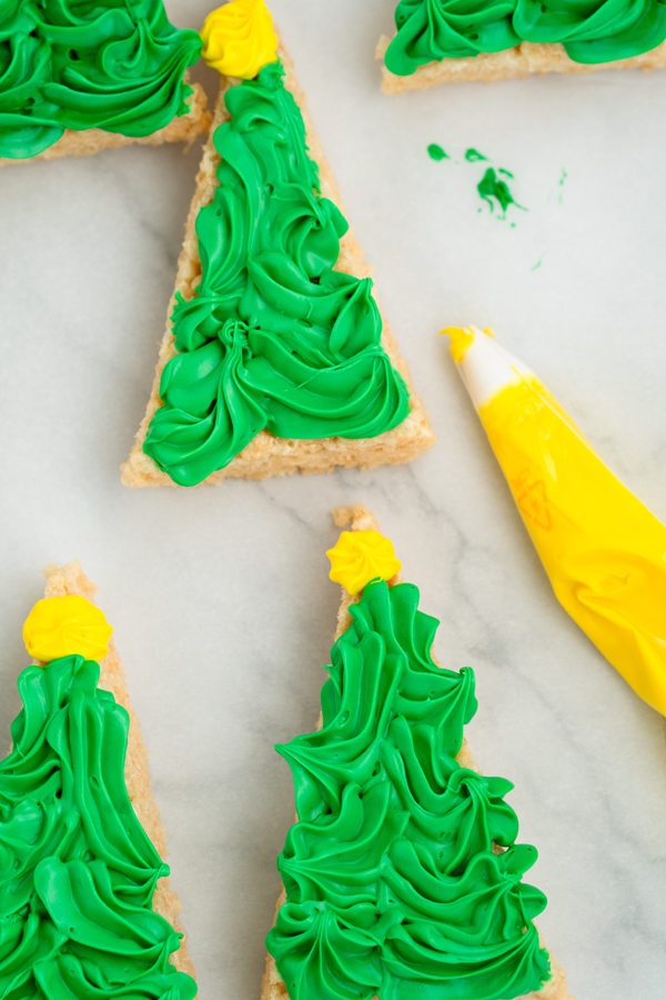 add yellow icing stars to the top of each treat