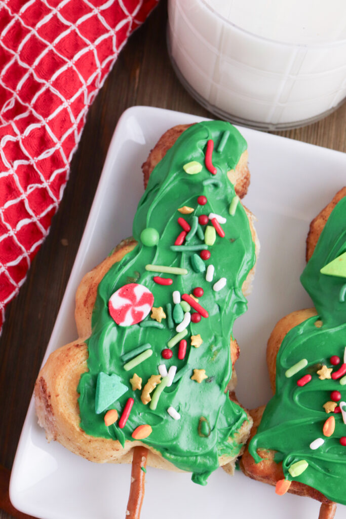 closeup of christmas tree cinnamon roll after decorating