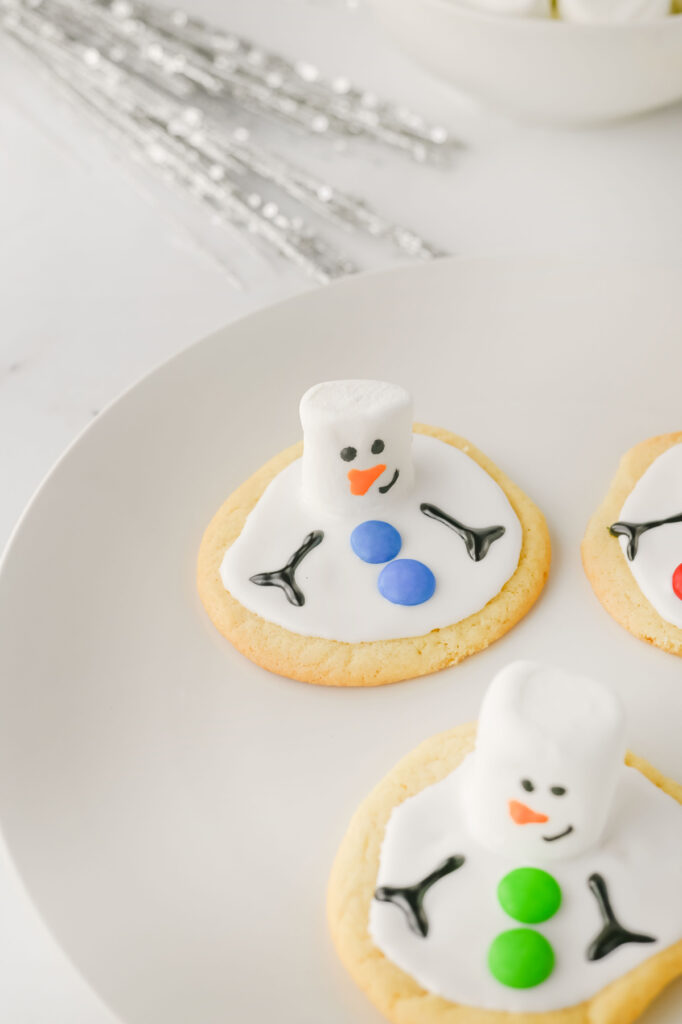 closeup of finished melting snowman cookies on a plate