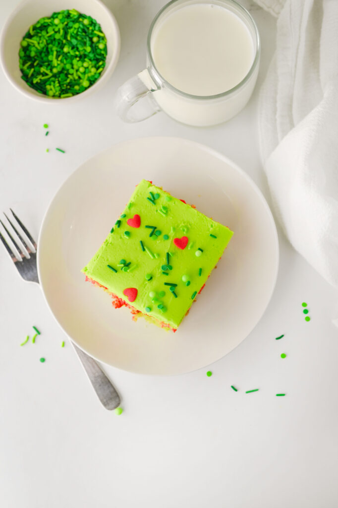 overhead shot of finished grinch poke cake on a plate