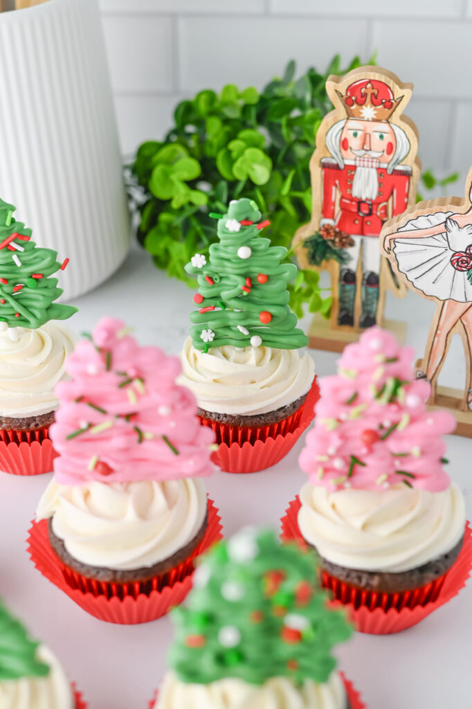 finished christmas tree cupcakes on a counter