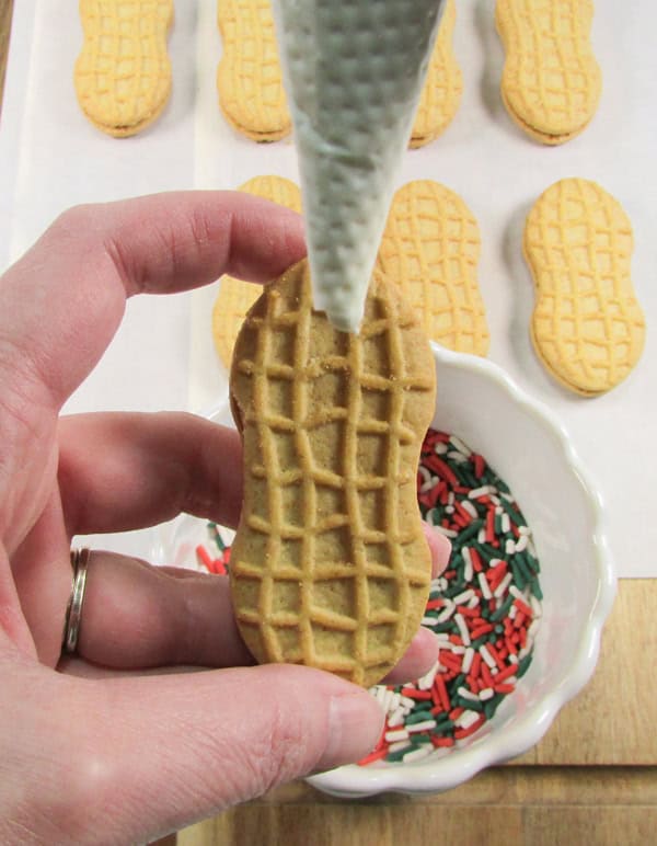 cut a hole in the piping bag and work one cookie at a time