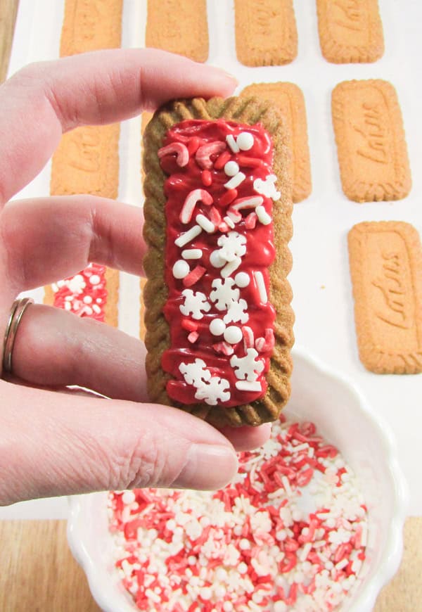 add sprinkles to the top of the cookie before the candy hardens
