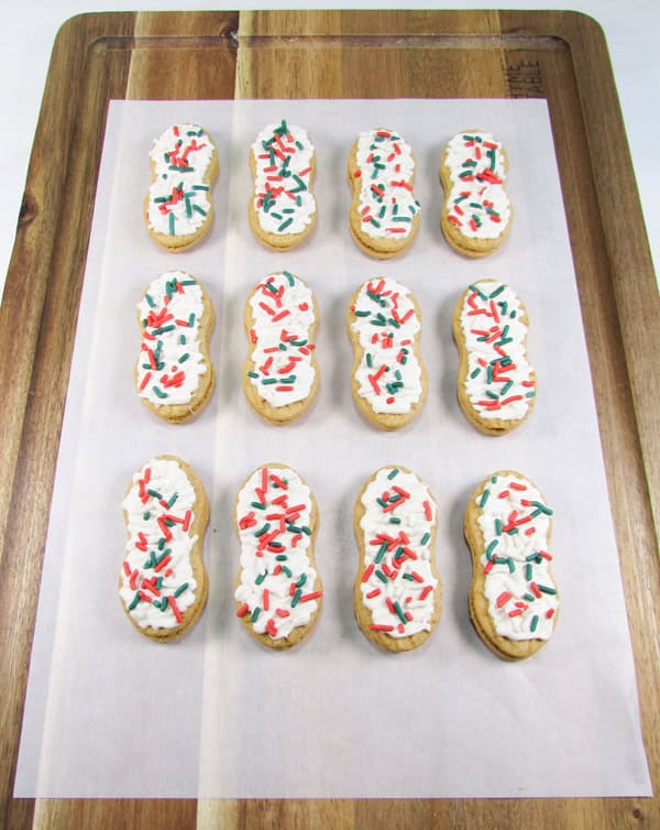 place the cookies on parchment paper until the candy hardens