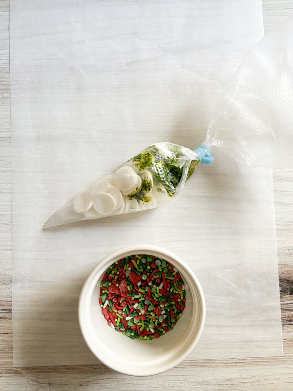 add candy and food coloring to piping bag