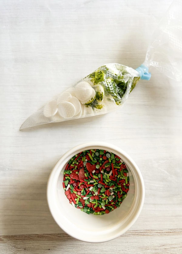 add food coloring and candy to piping bag