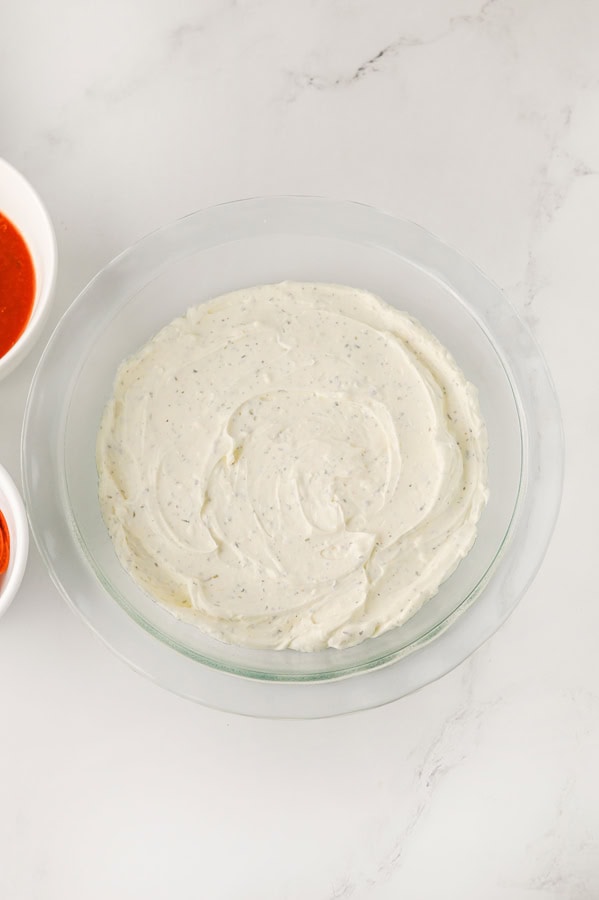 spread the cream cheese mixture into the bottom of a baking dish