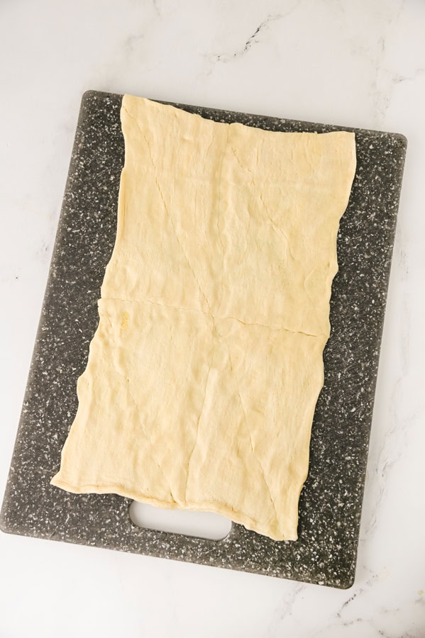 roll out the crescent dough and pinch seams