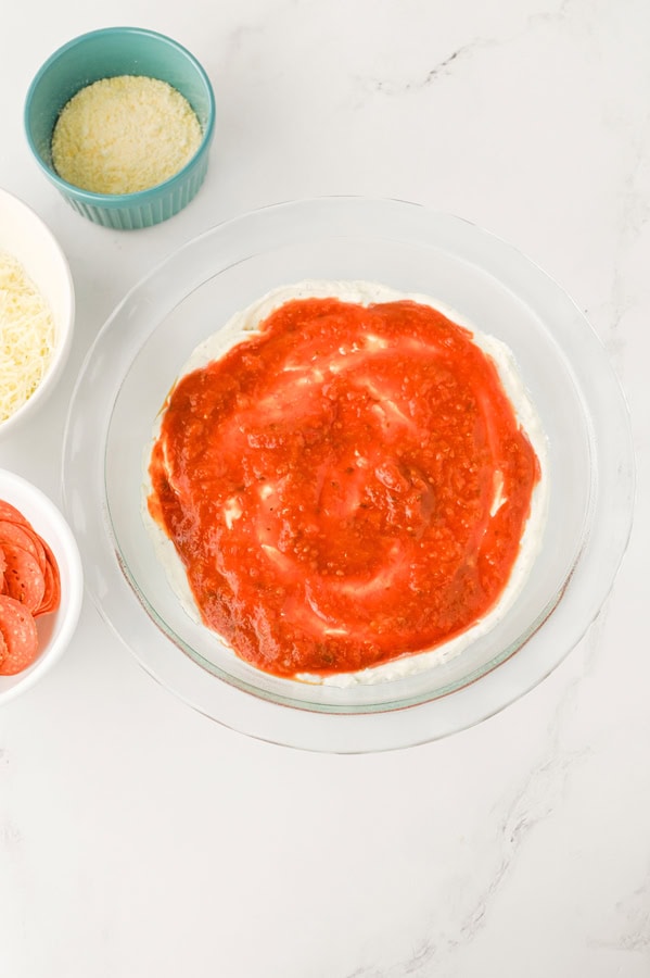 put the marinara on top of the cream cheese layer.