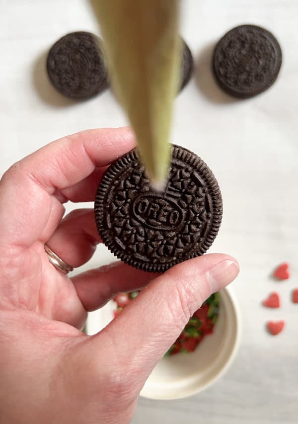 pipe candy into center of oreo