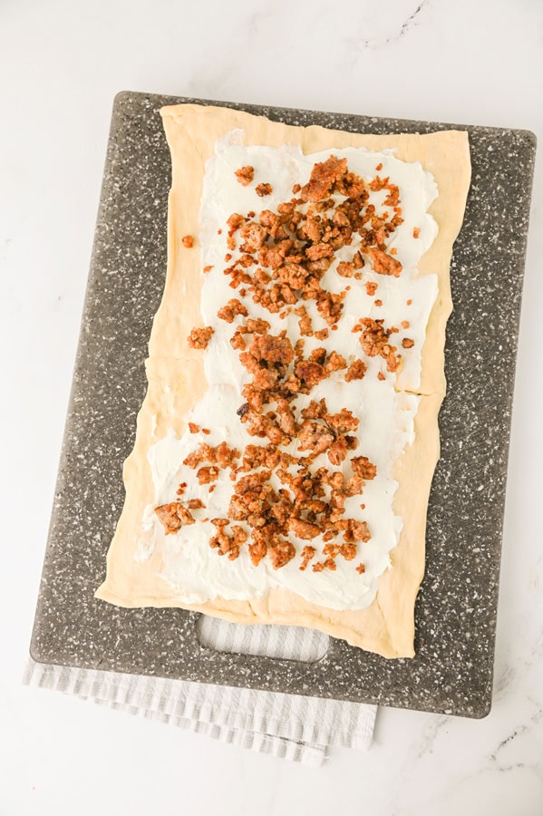 add sausage on top of the cream cheese