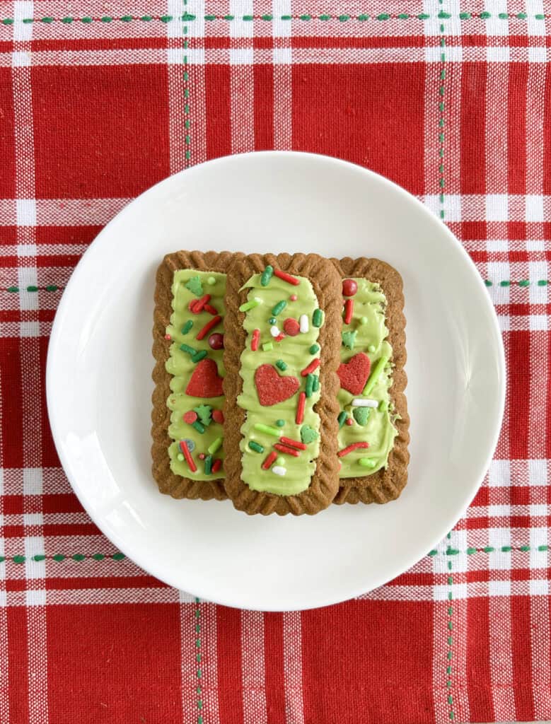 grinch biscoff cookies on a plate
